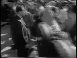 B/W 1963 high angle PAN Governor George Wallace + men leaving building during integration of U. of Alabama Stock Footage