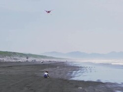 WS SLO MO View of small boy flies kite and runs along beach / Astoria, Oregon, United States  Stock Footage