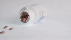 Bottle of Pills Fall In slow Motion Stock Footage