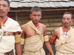 MS Shot of Naga tribesmen dancing in Hornbill Festival, Kisama / Kohima, Nagaland, India Stock Footage