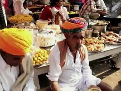 MS ZO Shot of locals buying prepared food at local market food stall / Pushkar, Rajasthan, India  Stock Footage