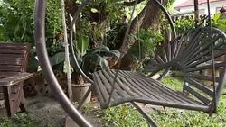 Panning shot old swing in garden format HD. Stock Footage