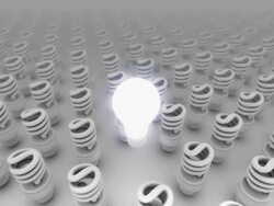 CGI old bulb glowing over new bulbs and pulling up to birds eye view Stock Footage