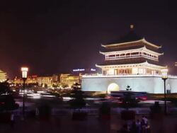Ancient Chinese towers surrounded by traffic Stock Footage