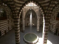 Tilt up from fountain to ceiling of grandiose building, Egypt (sound available) Stock Footage