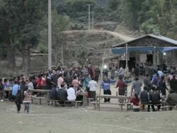 WS PAN crowd of people dancing in village / Xam Neua, Laos Stock Footage