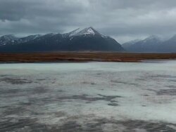 WS View of Wind making ripples on surface of Icy lagoon / Iceland  Stock Footage