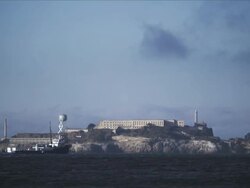 Alcatraz Island, a troller motors through foreground Stock Footage