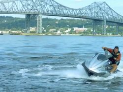 WS PAN SLO MO Shot of man riding on jet ski in circular motion / New York, United States Stock Footage