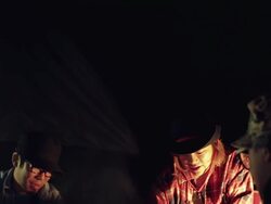 MS TD Shot of friends cooking food at camp site in night / Okutama, Tokyo, Japan Stock Footage