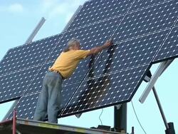 WS ZI PAN Technician testing photovoltaic array / Grass Lake, Michigan, USA  Stock Footage