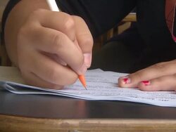 Student Writing On Paper Stock Footage