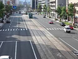 WS Shot of traffic way and tram in Hiroshima / Hiroshima, Japan Stock Footage