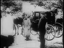 B/W 1910s PAN Franz Josef I greeting others + walking away from carriage Stock Footage
