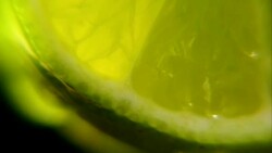 Bottom of Lime fruit close up slowly turning Black background Stock Footage