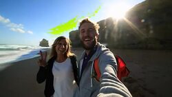 Young couple traveling take selfie on beach Stock Footage