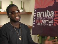 INTERVIEW 50 Cent aka Curtis Jackson on developing his character, his songs and more at the Aruba International Film Festival: Things Fall Apart Interview at Aruba . (Footage by WireImage Video/Getty Images Entertainment Video) Stock Footage