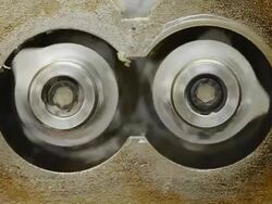 close up rotation blade in mold cavity on internal mixer Stock Footage