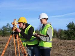 Land surveyors on construction site Stock Footage