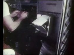 close up of open box + astronaut's hands in zero gravity Stock Footage