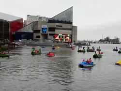 WS Shot of Baltimore Maryland Inner harbor with families out of dragon boats peddling for fun on Chesapeake Bay / Baltimore, Maryland, United States Stock Footage
