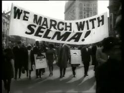 B/W 1960's civil rights march in city street / SOUND Stock Footage