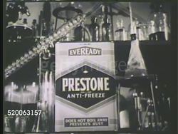 1935: PRESTONE ANTI-FREEZE: VS 'Prestone' antifreeze canister on table in laboratory, various lab equipment, including beakers, BG. Instructional Video
