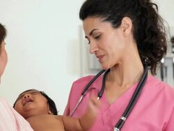 "hispanic medical worker talking to the mother of a hispanic infant patient/Richmond,Virginia, USA " Stock Footage