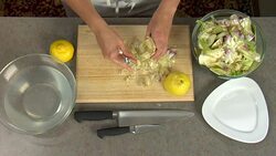 Overhead preparation of an artichoke for a food recipe. Stock Footage