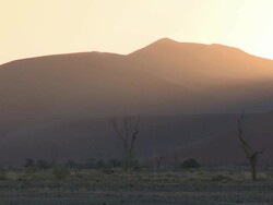Sand dunes in hazy evening light, Sossusvlei, Namib-Naukluft, Namibia Stock Footage