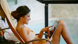 Healthy woman enjoys relaxing day at spa centre in swimsuit Stock Footage