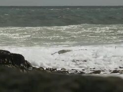 MS PAN SLO MO Waves crashing on rock / Elephant Beach, Falkland Islands, Falkland Islands Stock Footage