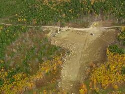 WS ARIEAL DS View of Being work with bulldozer at field / Maine, United States Stock Footage