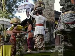 MS TU Women carrying offerings on her head in Pura Dalem Puri temple / Ubud, Bali, Indonesia Stock Footage