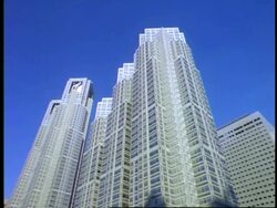 MS low angle view, tall skyscraper against blue sky, Tokyo Metropolitan Government, Shinjuku, Tokyo, Japan Stock Footage