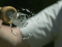 High speed Hose spraying ring of water to camera Stock Footage