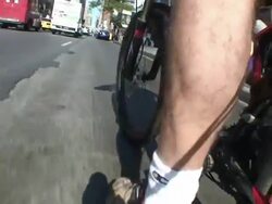 A bicyclist pedals with traffic in New York City. Stock Footage