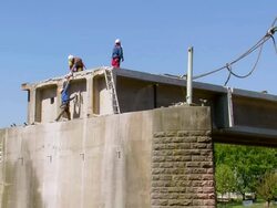 WS Workers working at deconstruction of bridge over river Mosel / Wellen, Rhineland Palatinate, Germany Stock Footage