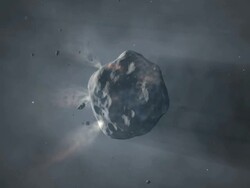 Comet nucleus releasing gasses as it approaches and is warmed by the Sun Stock Footage
