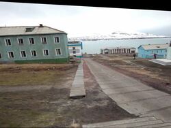 The mains square with the world's second most northernly statue of Lenin in Barentsburg, a Russian mining settlement on Svalbard archipelago Stock Footage