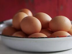 MS PAN Shot of eggs in white bowl / London, United Kingdom  Stock Footage