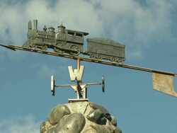 "CU of weather vane [Steam Train on arrow/plane], Seward, Kenai Peninsula, Alaska on a sunny day. " Stock Footage
