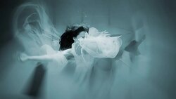 Caucasian woman in dress swimming under water Stock Footage