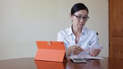 Woman working with her tablet Stock Footage
