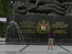 ZO Tourists taking pictures at the National Monument / Kuala Lumpur, Malaysia Stock Footage