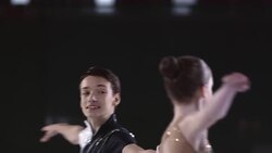 SLO MO Figure skating pair holding hands in spin Stock Footage