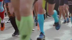 Marathon running race with people legs and feet Stock Footage