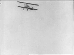 B/W 1910s 2 biplanes flying thru clouds / World War I / newsreel Stock Footage