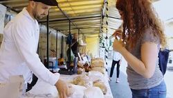 Buying Bread at Farmers Market Stock Footage