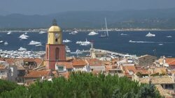 St Tropez with Church Bell Tower and yachts in the distance.4K Stock Footage